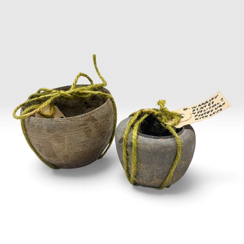Lot 1 - A Chinese grey pottery footed urn, Warring States (c 475- 221BC)