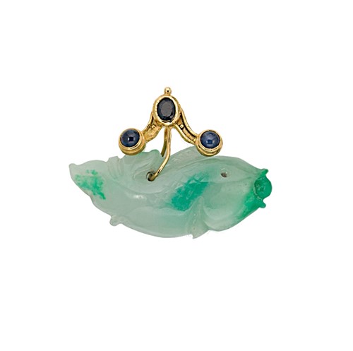 Lot 79 - A jade and sapphire fish pendant