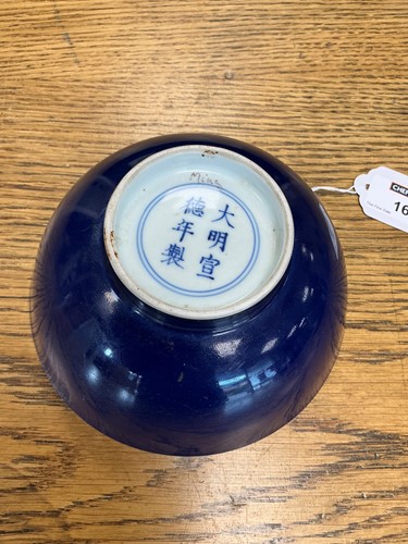 Lot 16 - A Chinese blue monochrome bowl, mark of Xuande and possibly of the Period