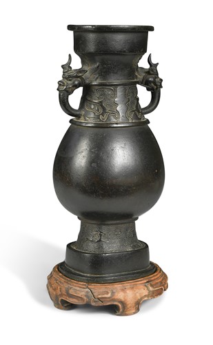 Lot 15 - A Chinese bronze dragon vase, early Ming Dynasty, 14th/15th century