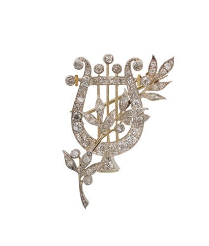 Lot 106 - An early 20th century diamond set floral harp brooch