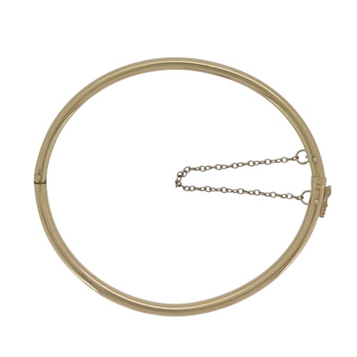 Lot 72 - A 14ct gold hinged bangle, inside diameter...