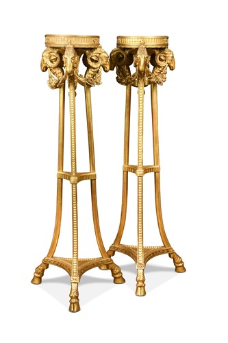 Lot 499 - A pair of Neoclassical style carved giltwood torchères, 19th century