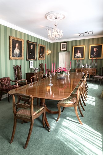 Lot 573 - A George III style mahogany triple pillar dining table by William Tillman