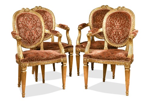 Lot 494 - A set of four Victorian carved giltwood open armchairs