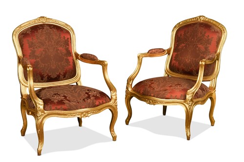 Lot 513 - A pair of French Louis XV style gilt wood fauteuils, 19th century