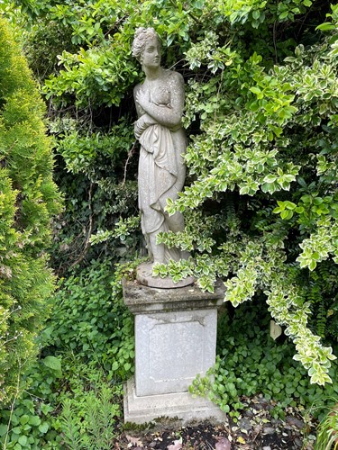 Lot 607 - A composite stone figure of a female nude, late 20th century