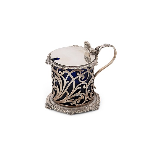 Lot 381 - An Edward VII silver mustard pot and glass liner