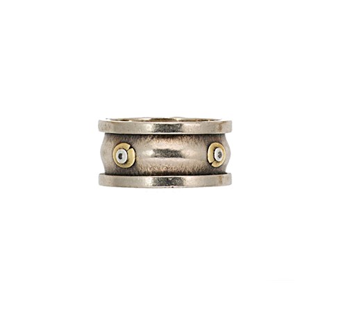 Lot 152 - An 18ct two colour gold diamond set band