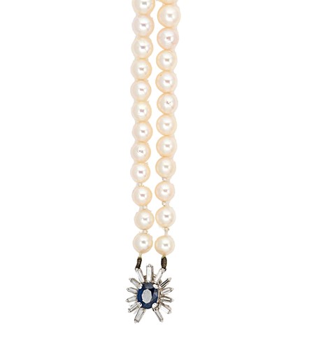 Lot 163 - A double row cultured pearl necklace with a sapphire and diamond clasp