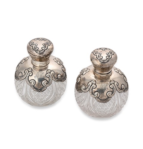 Lot 378 - A pair of Edward VII silver mounted cut glass scent bottles