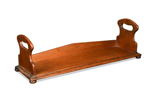 Lot 617 - A mahogany book trough, early 19th century