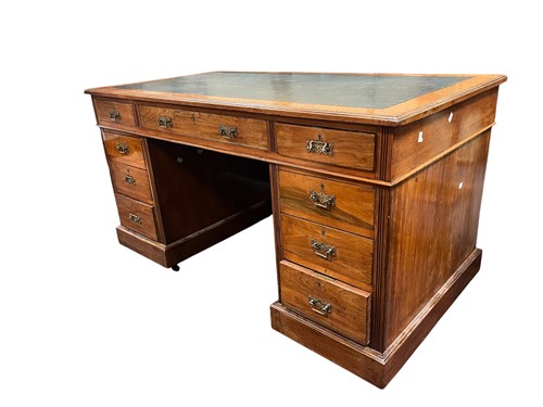 Lot 572 - An Edwardian twin pedestal desk, with an...