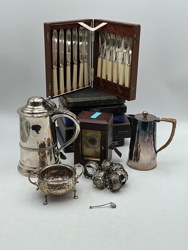 Lot 323 - A set of six silver napkin rings, a brass...