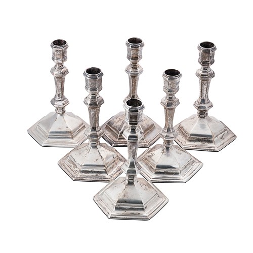 Lot 441 - An associated set of six silver candlesticks