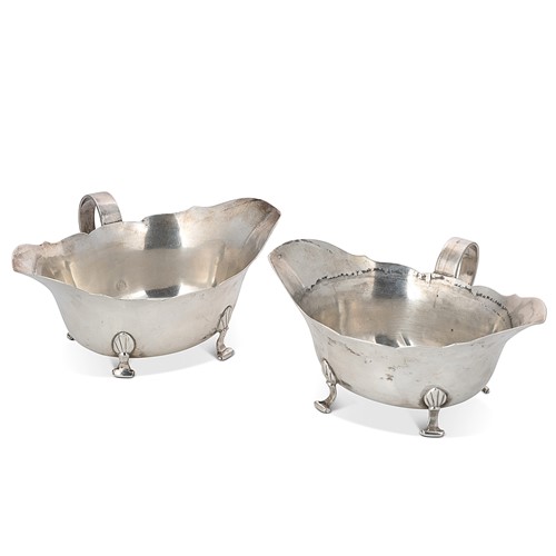 Lot 411 - A matching pair of double lipped George V silver sauce boats