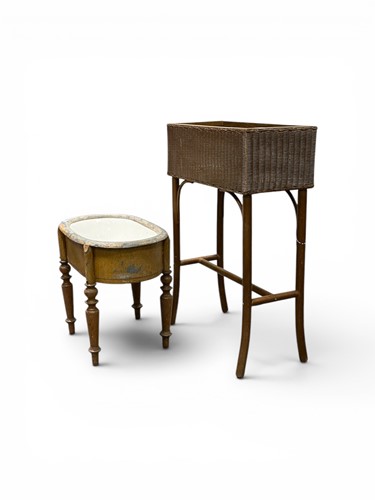 Lot 584 - A Lloyd loom wicker planter on stand, label to...