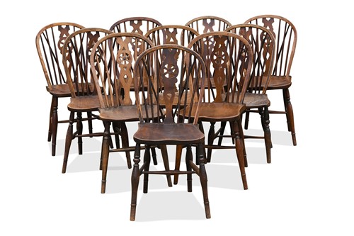 Lot 317 - A harlequin set of ten wheel back ash and elm dining chairs, 19th century and later