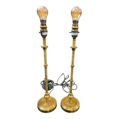 Lot 179 - A pair of knopped brass candlestick lamps with...