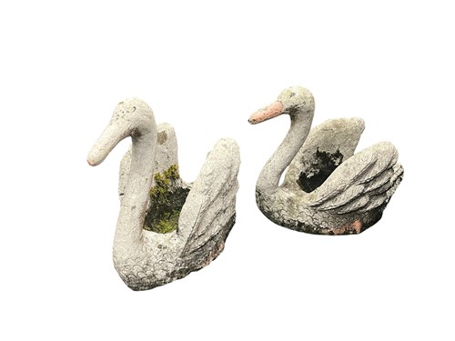 Lot 773 - A pair of cast composition stone swan planters,...