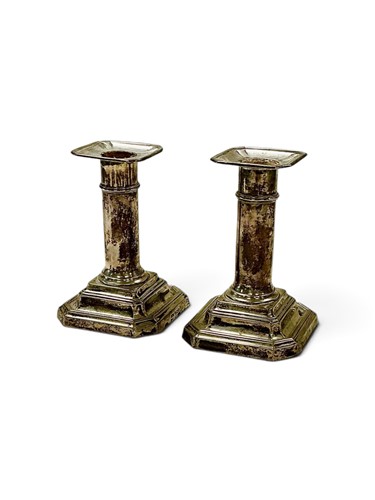 Lot 285 - A pair of Edward VII silver dwarf candlesticks