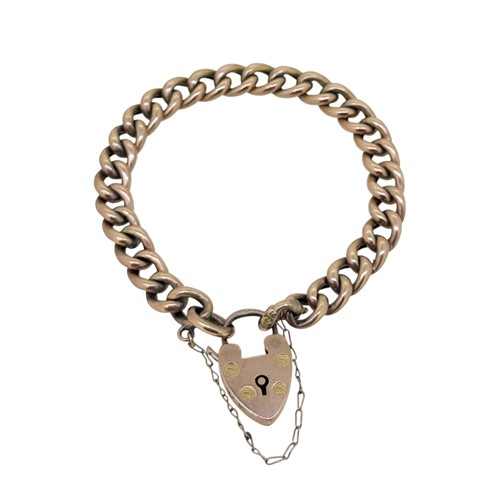Lot 16 - A curb link bracelet with a padlock fitting,...