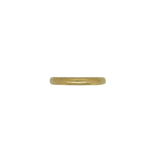 Lot 20 - A wedding band, approximate size K, hallmarked,...