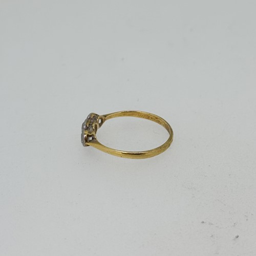 Lot 4 - An early 20th century three stone diamond ring,...
