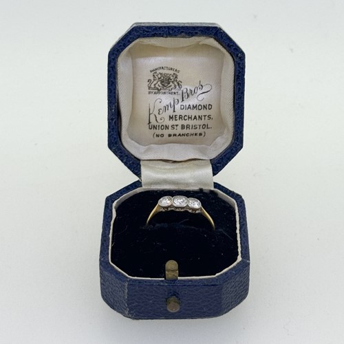 Lot 4 - An early 20th century three stone diamond ring,...