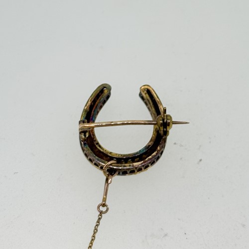 Lot 5 - A split pearl horseshoe brooch, dimensions 2.5...