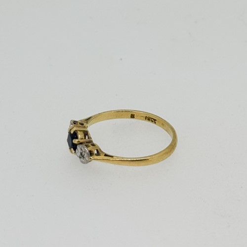Lot 7 - A sapphire and diamond three stone ring, size...