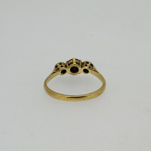 Lot 7 - A sapphire and diamond three stone ring, size...
