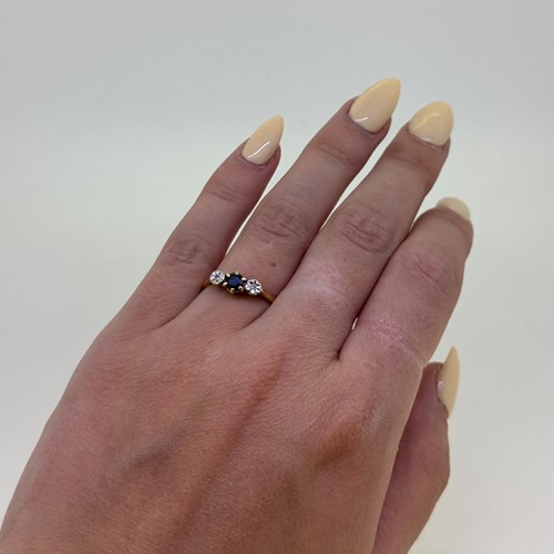 Lot 7 - A sapphire and diamond three stone ring, size...