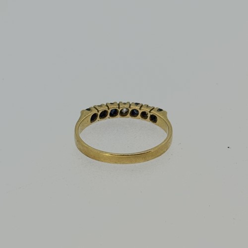 Lot 8 - A sapphire and diamond half hoop style ring,...