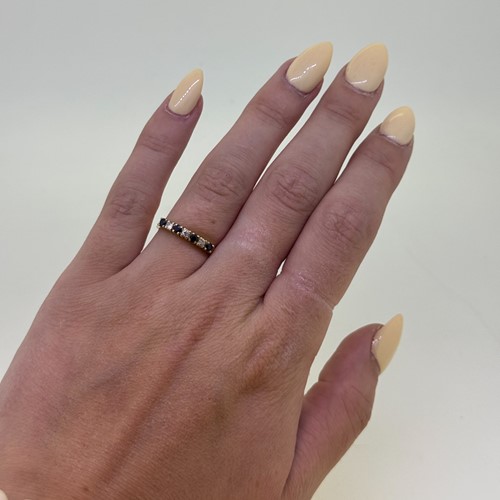 Lot 8 - A sapphire and diamond half hoop style ring,...