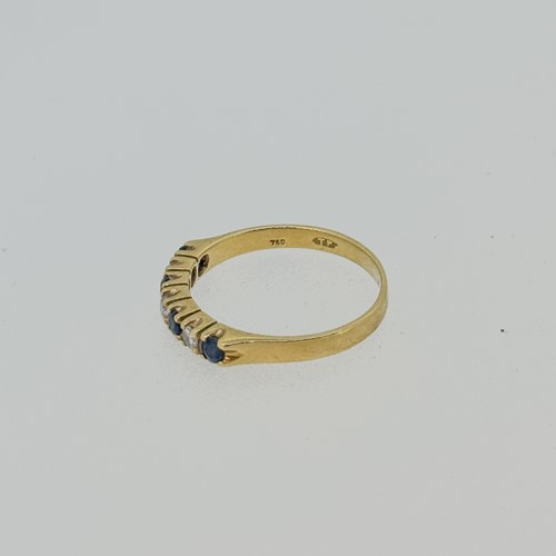 Lot 8 - A sapphire and diamond half hoop style ring,...