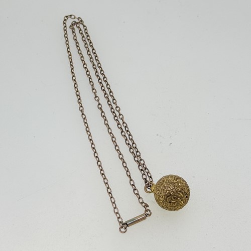 Lot 12 - A Victorian ball pendant and chain, pendant...