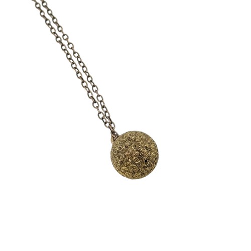 Lot 12 - A Victorian ball pendant and chain, pendant...