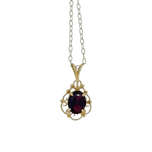 Lot 13 - A 9ct gold garnet pendant and chain, length of...