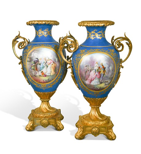 Lot 515 - A pair of French porcelain, two-handled ormolu mounted vases, probably Sevres