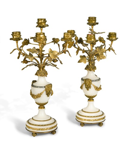Lot 432 - A pair of Louis XVI style four-light candelabra