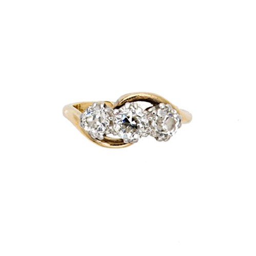 Lot 87 - A three stone diamond crossover style ring