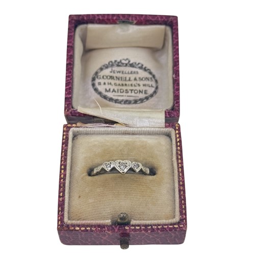 Lot 33 - A three stone diamond heart shaped ring, size...