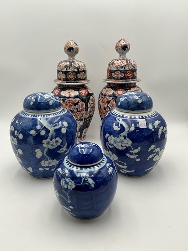 Lot 77 - A pair of 19th century lidded baluster vases...