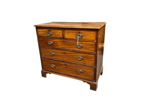 Lot 688 - A George III mahogany chest of two short and...