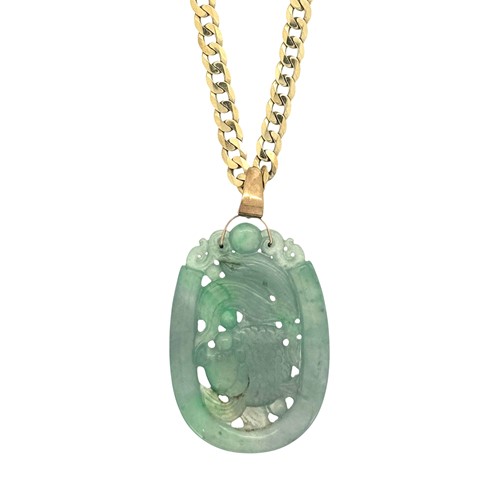Lot 47 - A carved jade pendant and chain, length of...
