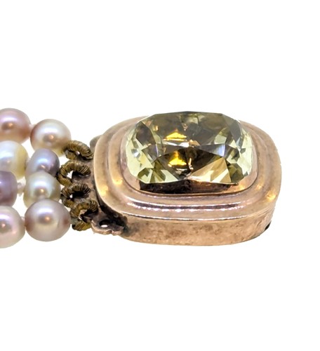 Lot 11 - A four row cultured freshwater pearl necklace