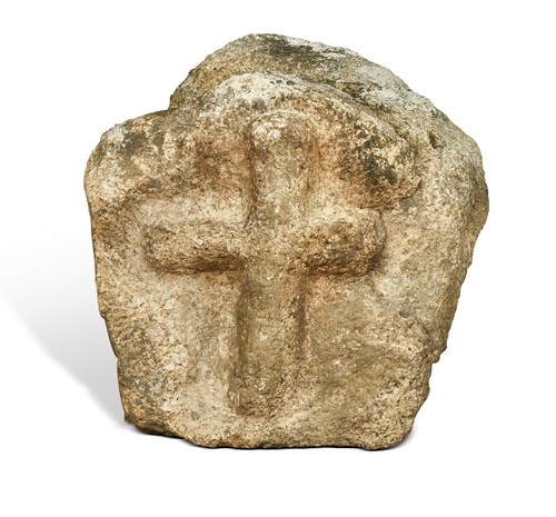Lot 302 - A carved stone depicting a crucifix in relief