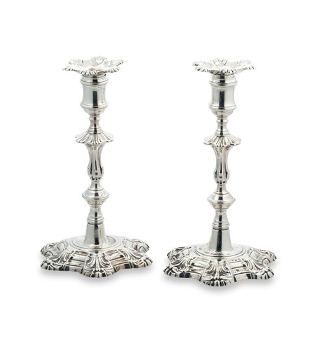 Lot 322 - A pair of George II silver candlesticks