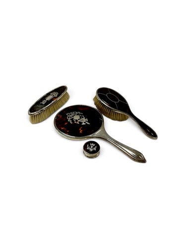 Lot 304 - A silver and tortoiseshell four-piece dressing...